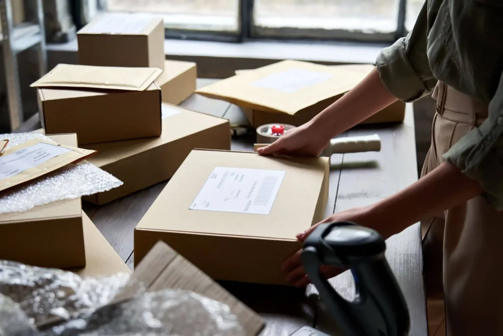 girl packing a product in box