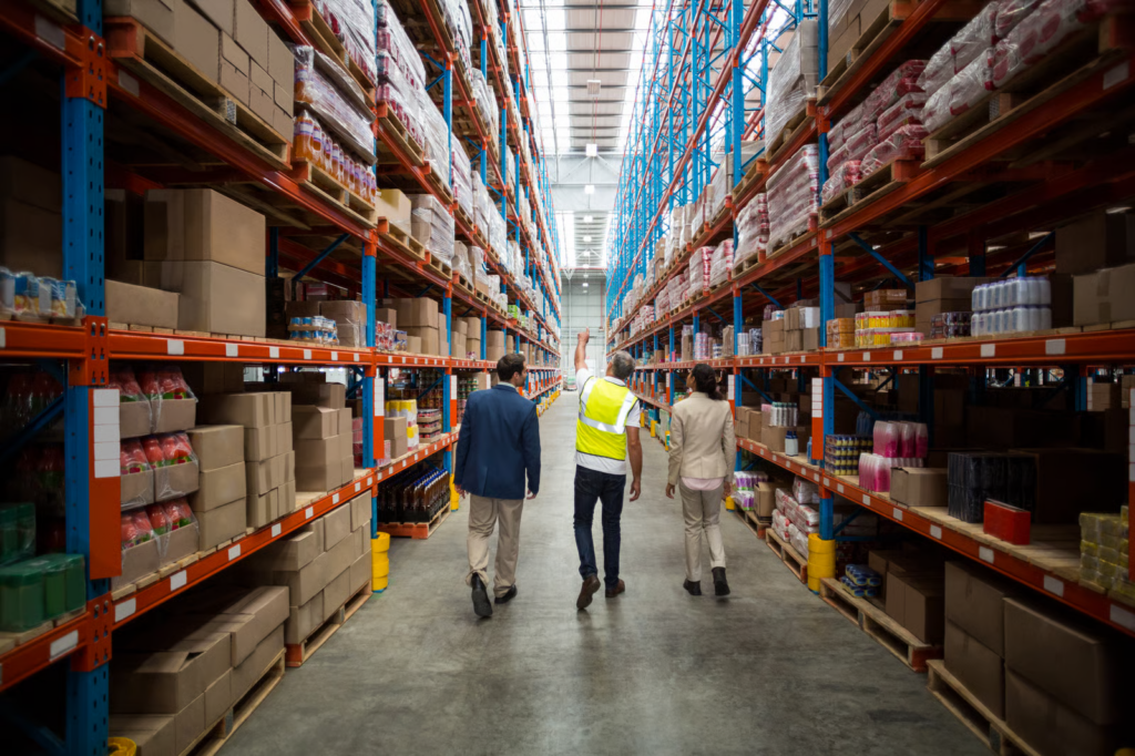 Staff walking in a warehouse aisle