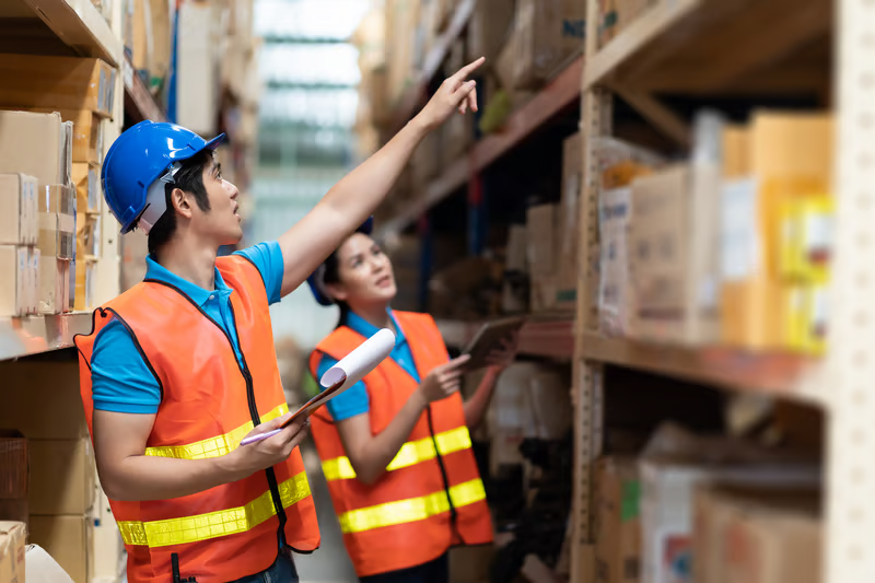 Workers inspecting boxes