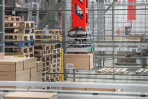 robotics picking up packages in warehousing
