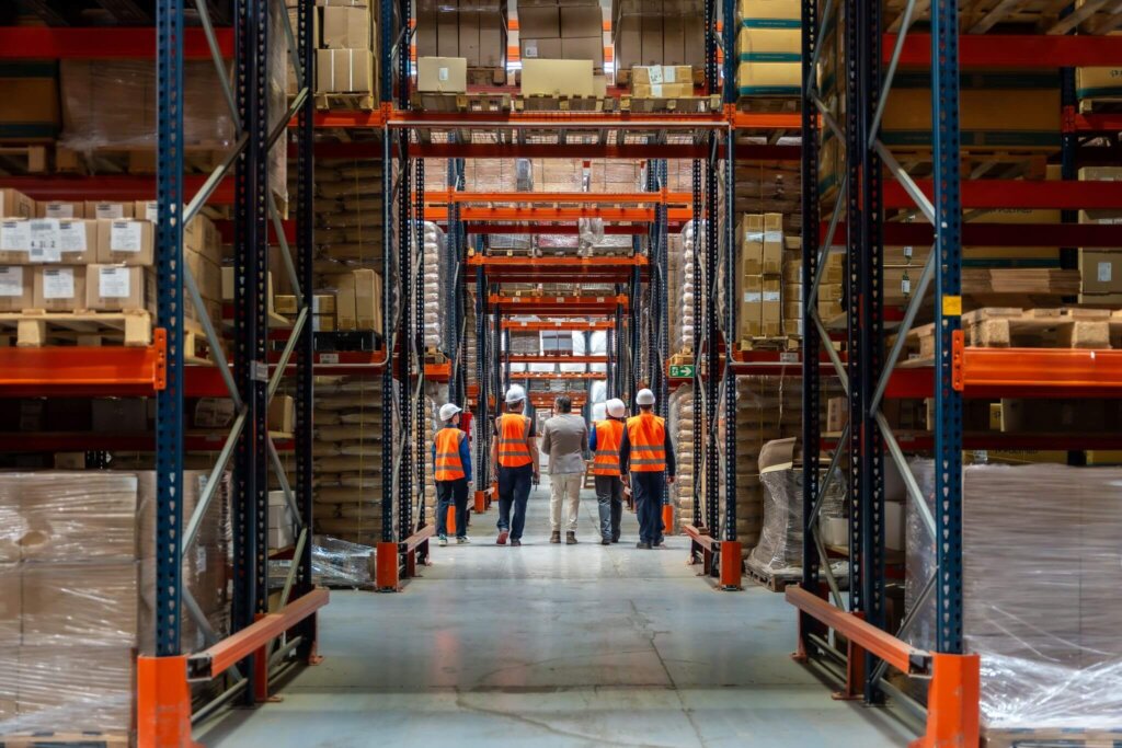 group of people walking in logistic warehouse